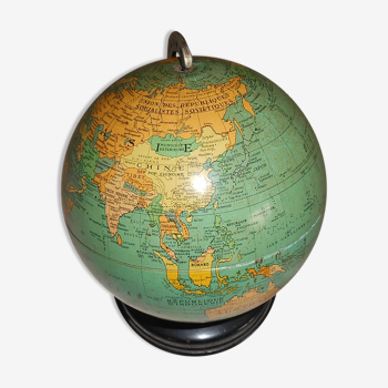 Ancient globe in earthly sheet metal