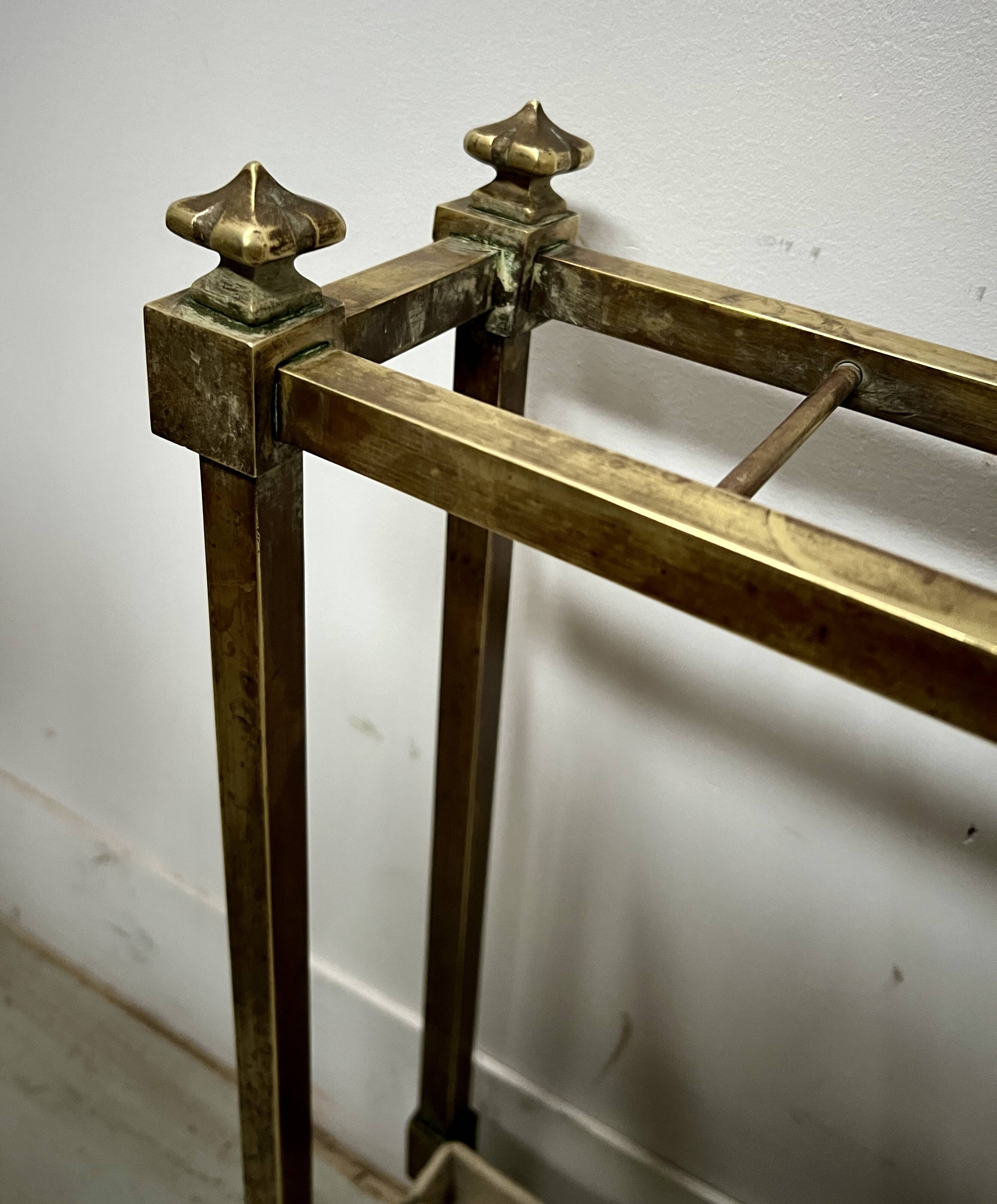 Brass and sheet metal umbrella stands from the 20th century.