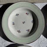 Set of 9 vintage turquoise deep plates with gold trim and pink flowers.