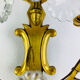 Bronze wall light with rococo style Louis XV pendants.