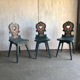 Set of 3 vintage wooden accent chairs painted navy blue, with 1920s decorated backs.