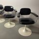 A striking set of four vintage swivel dining chairs