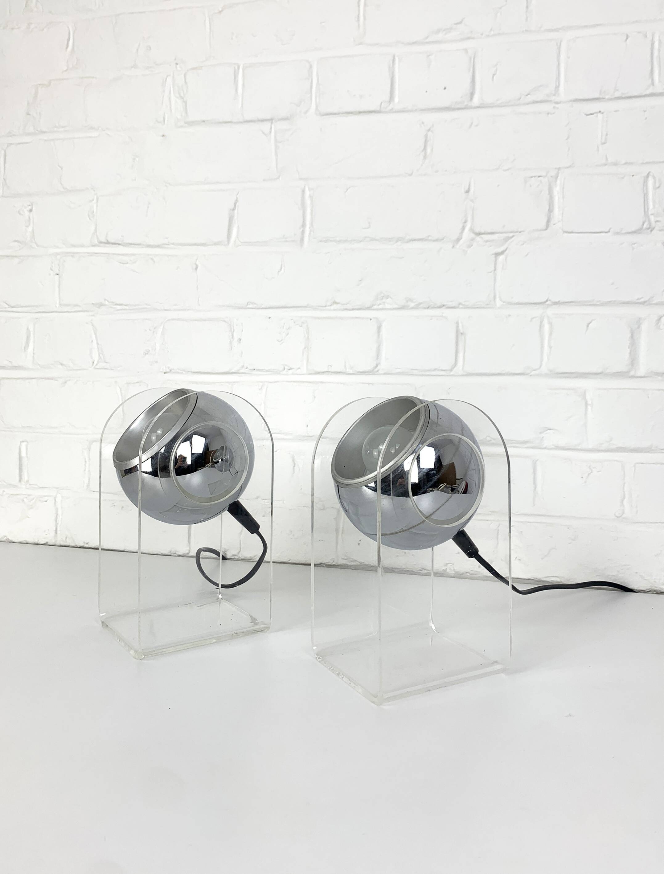 Pair of space age chrome plexiglass sphere table lamps from the 70s