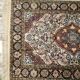 Handmade Persian carpet in wool and silk.