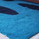 Handmade artisan rug in beige, size 150x250 cm.