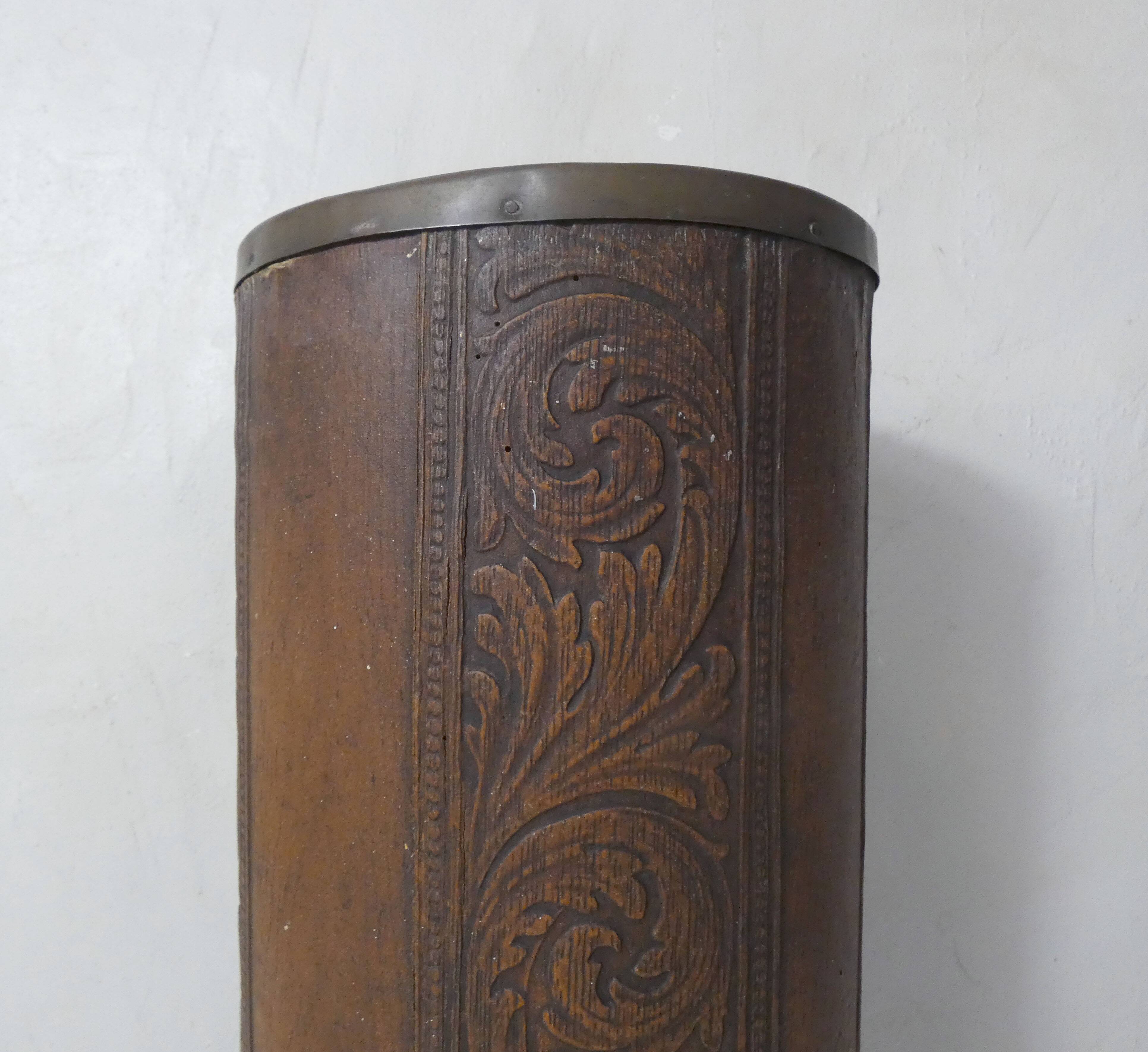 old carved wooden umbrella stand