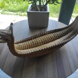 Original and vintage woven basket in the shape of an Asian dragon