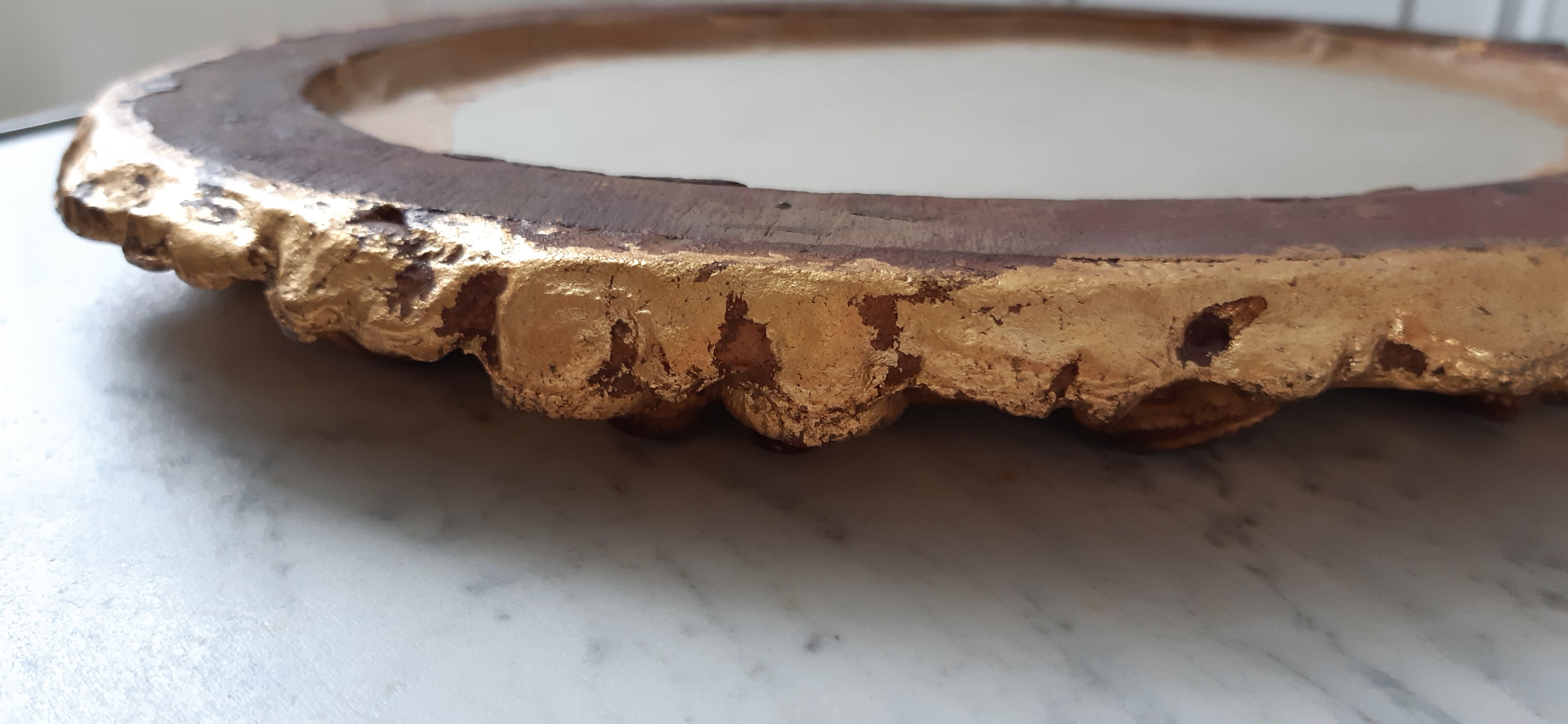 Old mirror in gilded wood late nineteenth