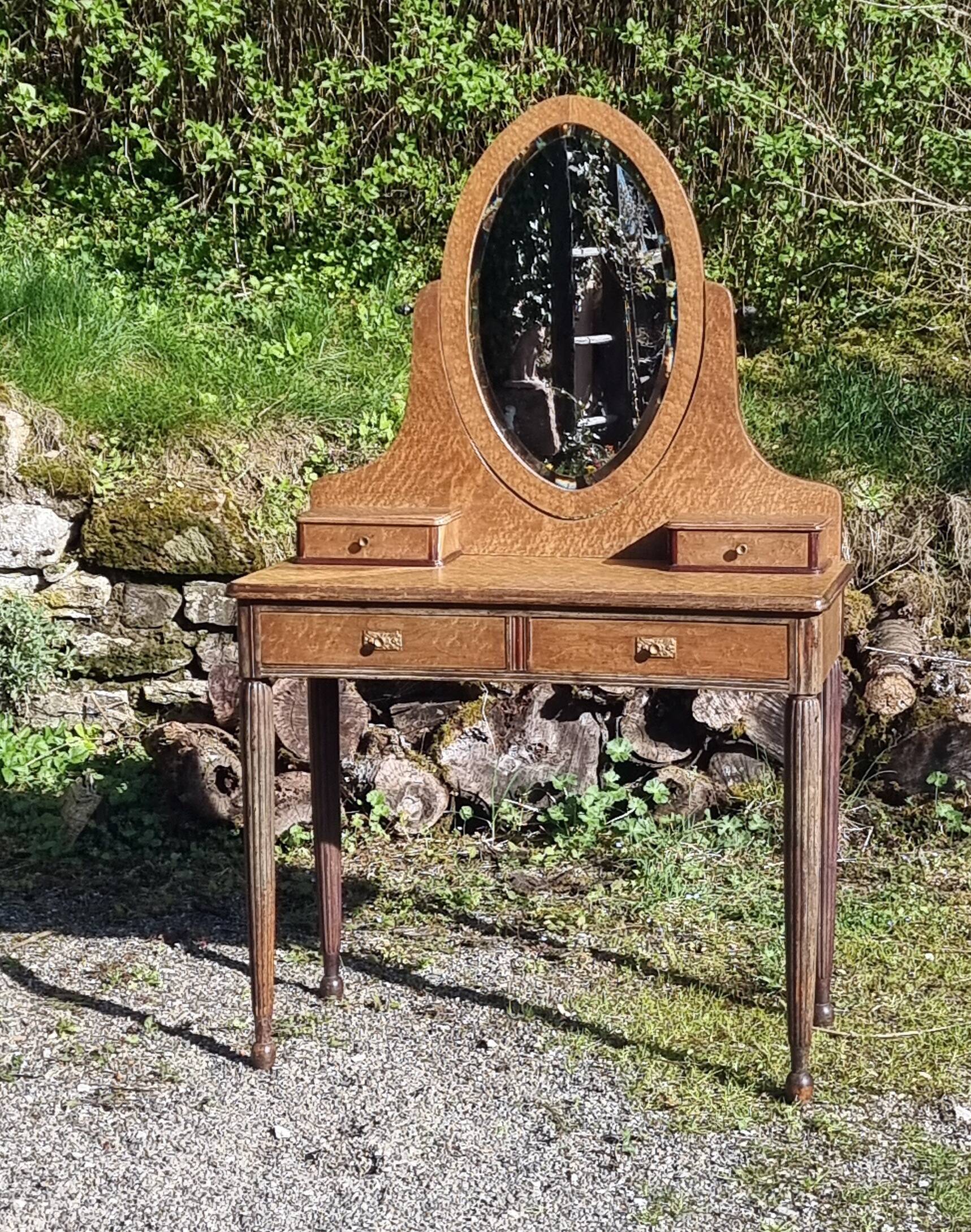 Dresser from the early 19th century with a cheval mirror.