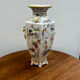 Porcelain vase with flower decorations by Dawen Wang.