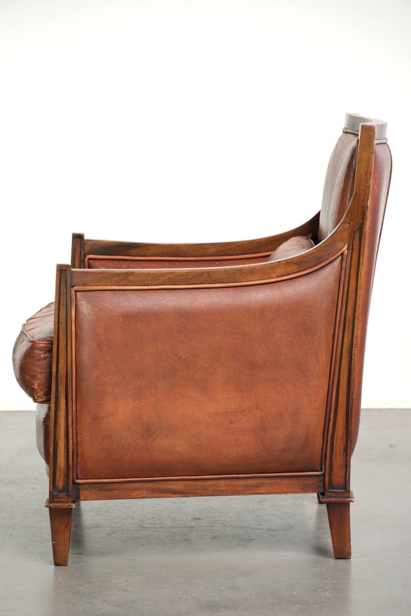 Sheepskin Art Deco design armchair with a comfortable seat and warm colours