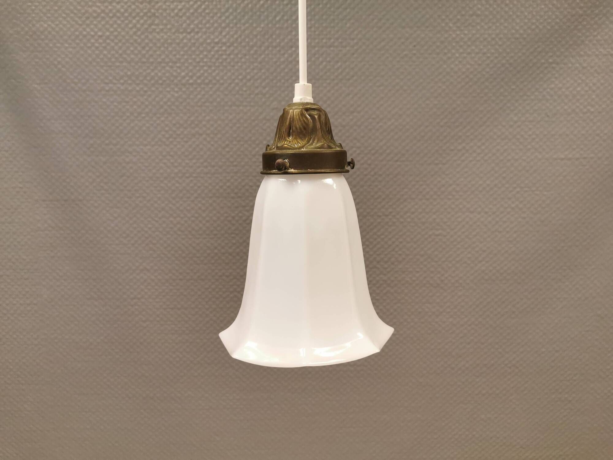 Small delicious tulip shaped hanging lamp in white opal glass with brass top.