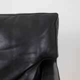Pair of armchairs in black leather and chrome metal. 1970s.