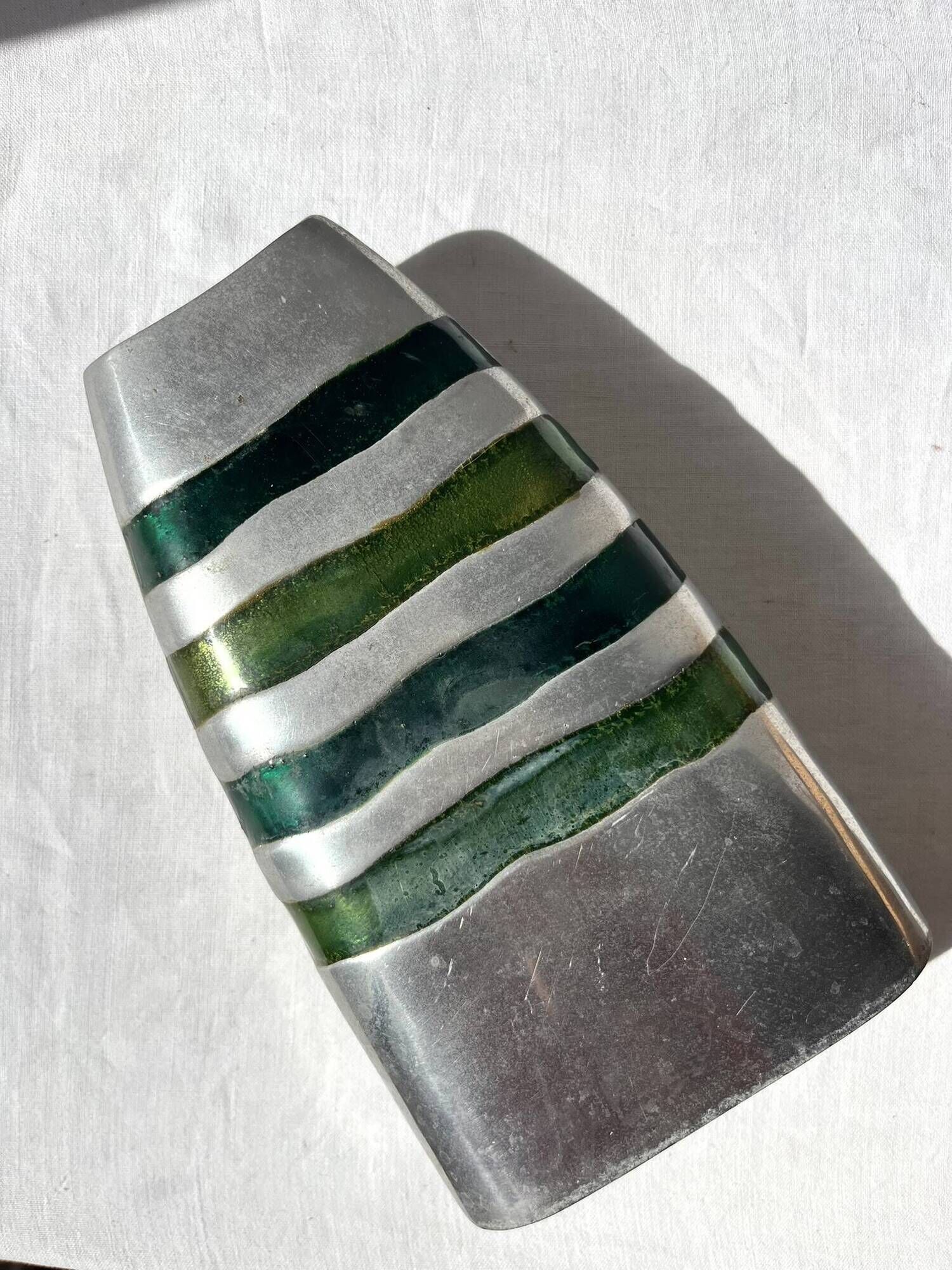 Vintage brushed aluminium vase with green stripes.