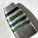 Vintage brushed aluminium vase with green stripes.
