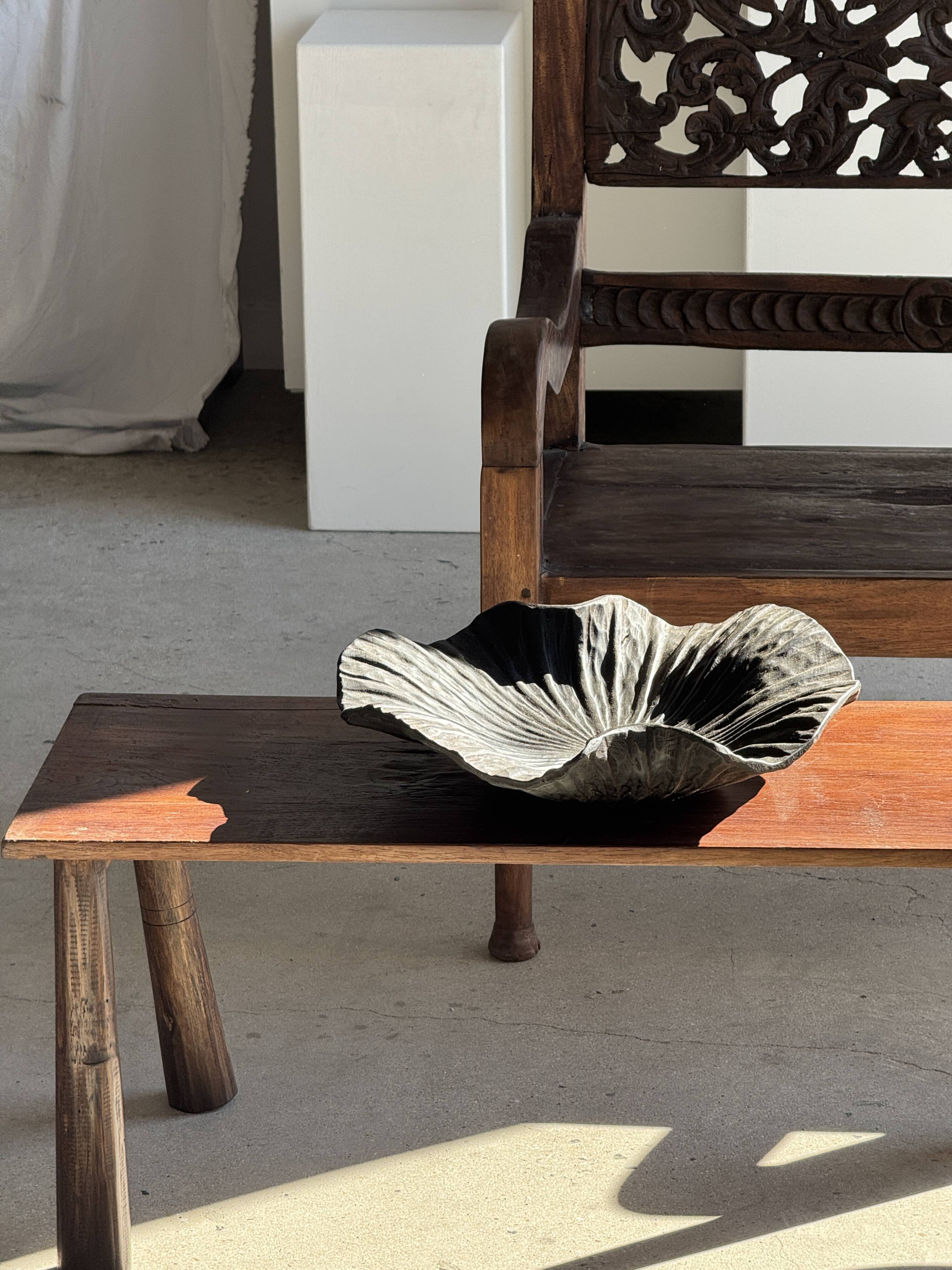 Black solid mango side table (monoxyle) with conical legs