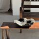 Black solid mango side table (monoxyle) with conical legs
