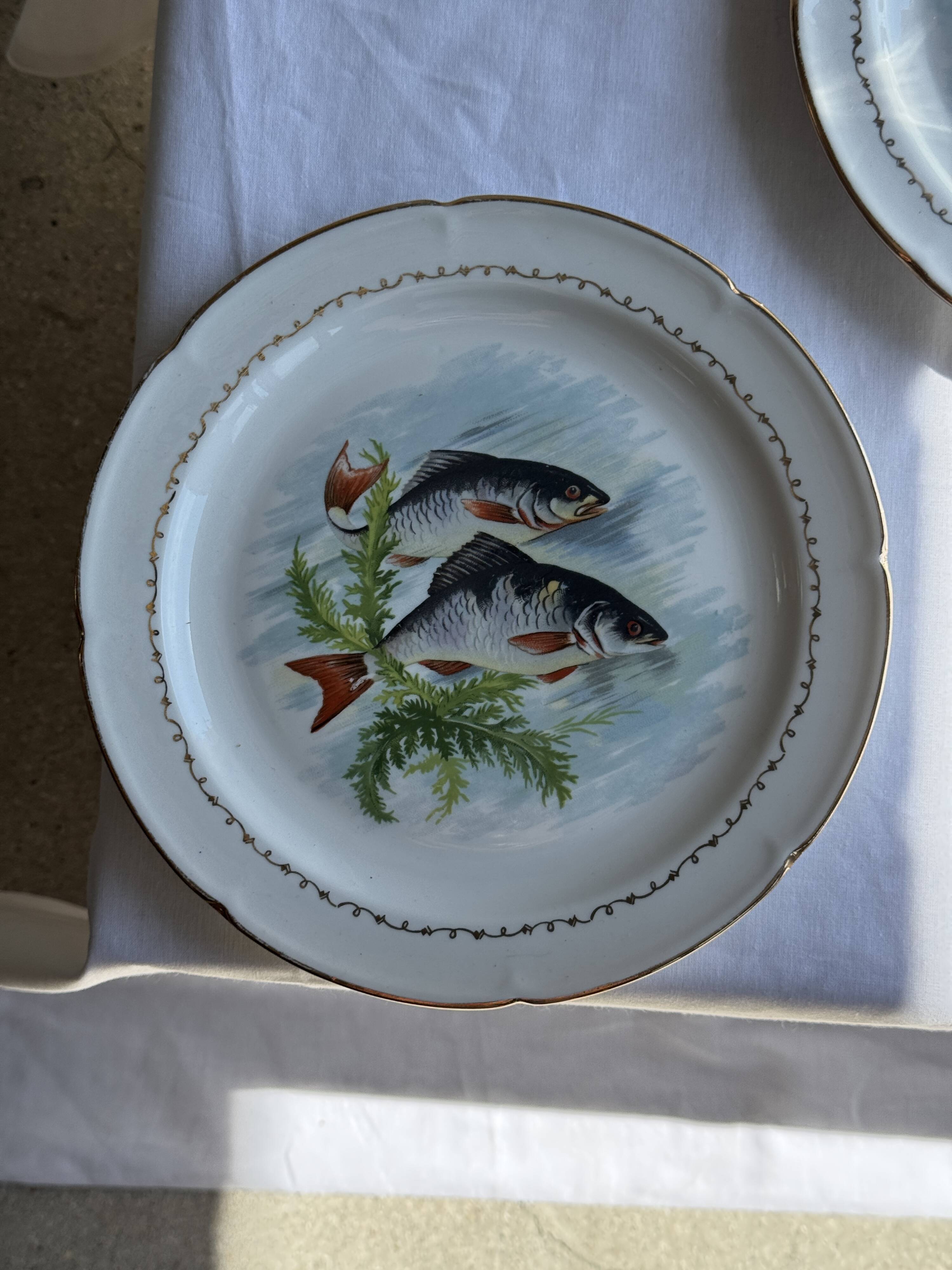 Set of 6 vintage Limoges porcelain plates with fish design.