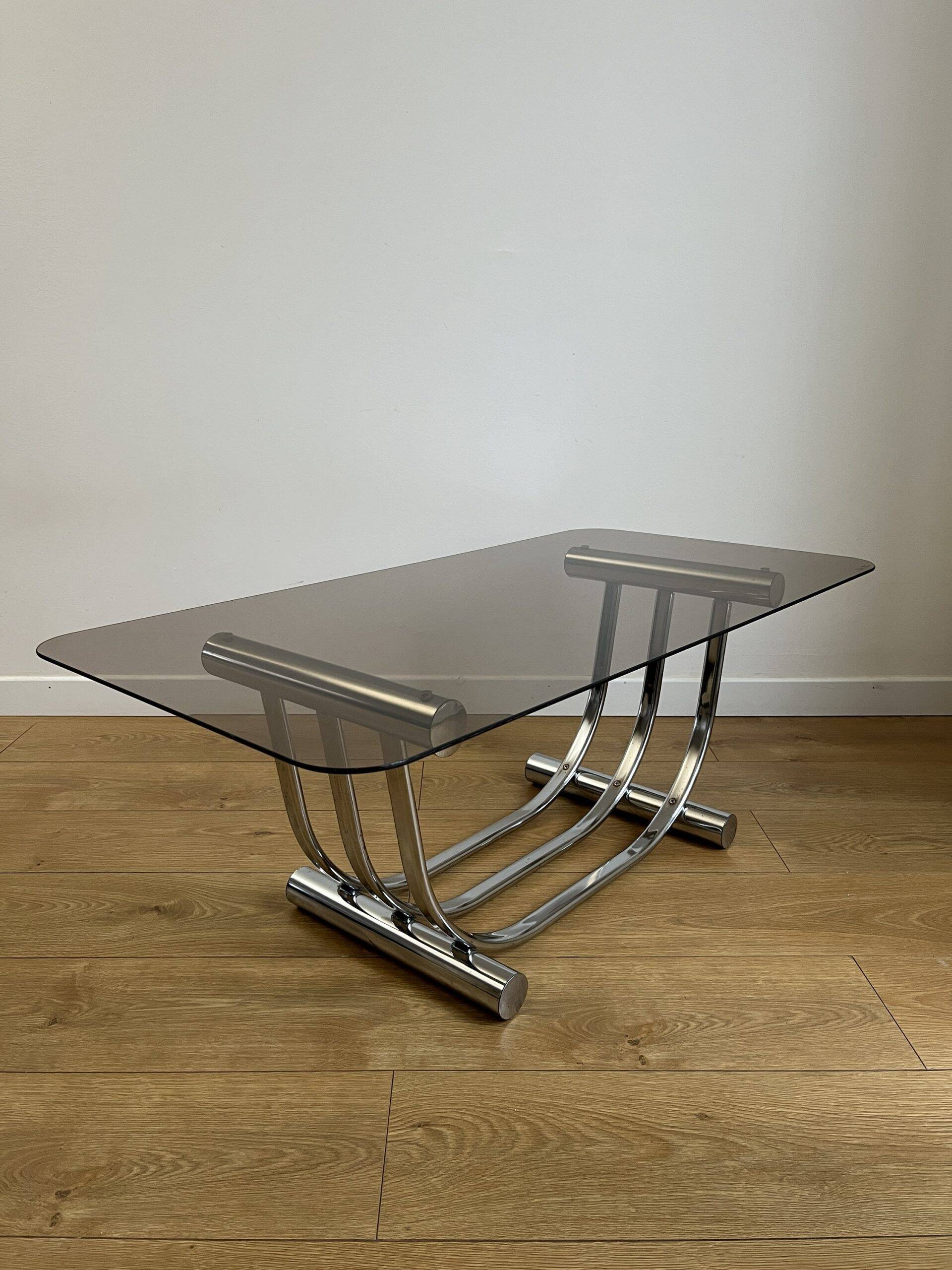 Smoked glass coffee table and chrome base by Yves Boutboul