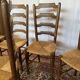Set of 5 antique oak and straw chairs.