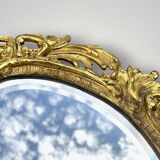 Antique bronze wall sconce with two candlesticks and beveled mirror