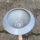 Vintage ashtray on a beige and grey metal stand.