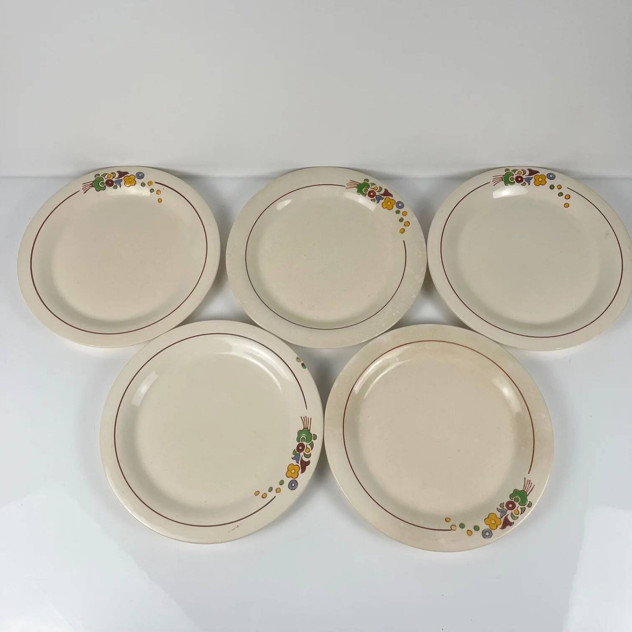Set of 5 dessert plates Longwy, early 20th century, floral decoration.