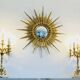 Massive gilded bronze chandeliers from the mid-20th century with marble bases.