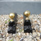 Old cast iron and xl brass andirons in neo classical style