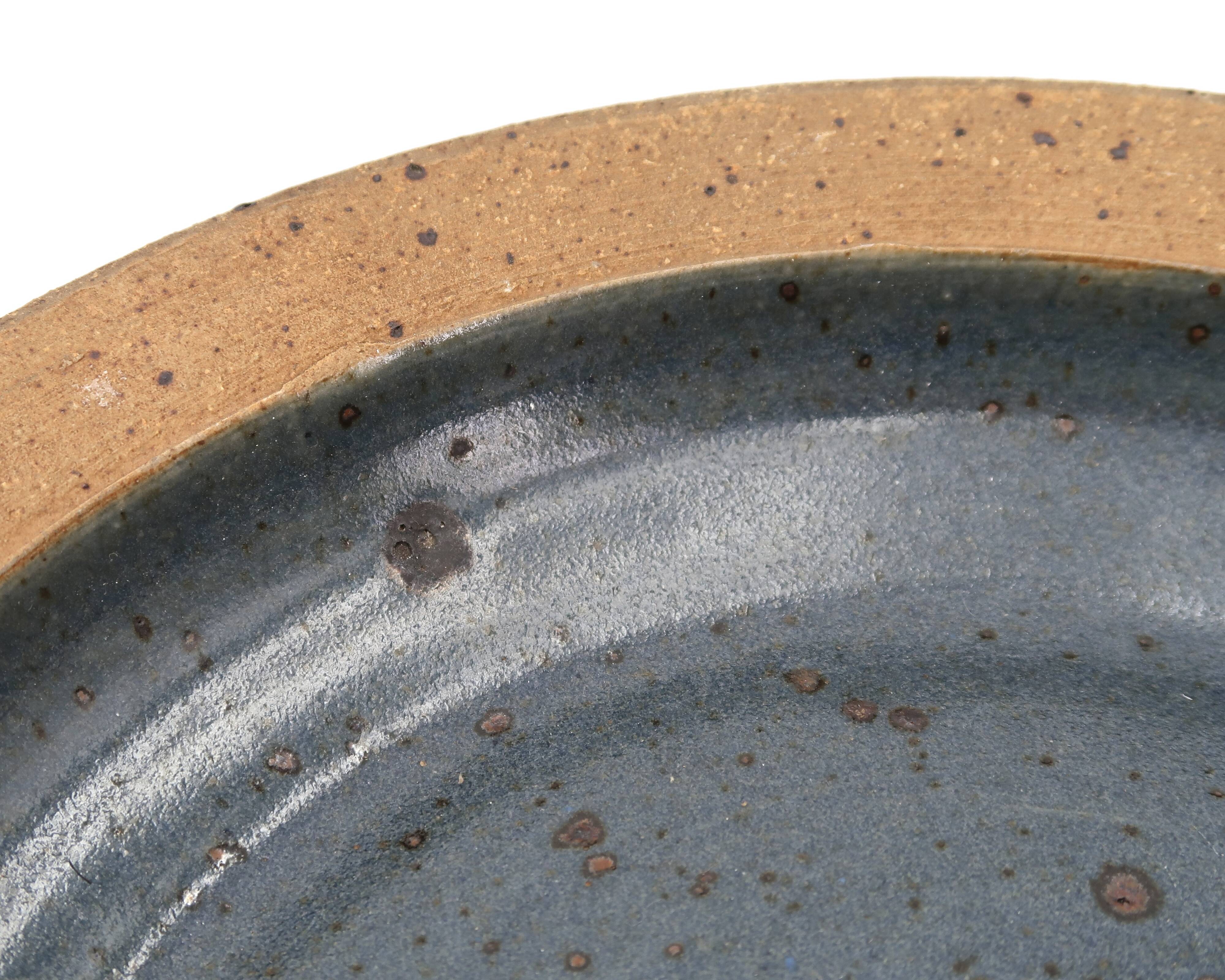 Round hollow plate in stoneware by Pierre Digan, La Borne, blue ceramic from the 1960s.