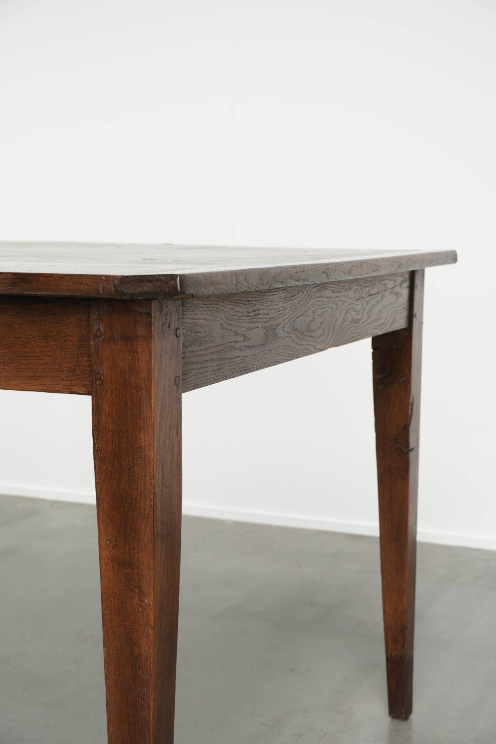 Antique French oak dining table from the early 19th century