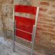 Red Plexiglas folding chair