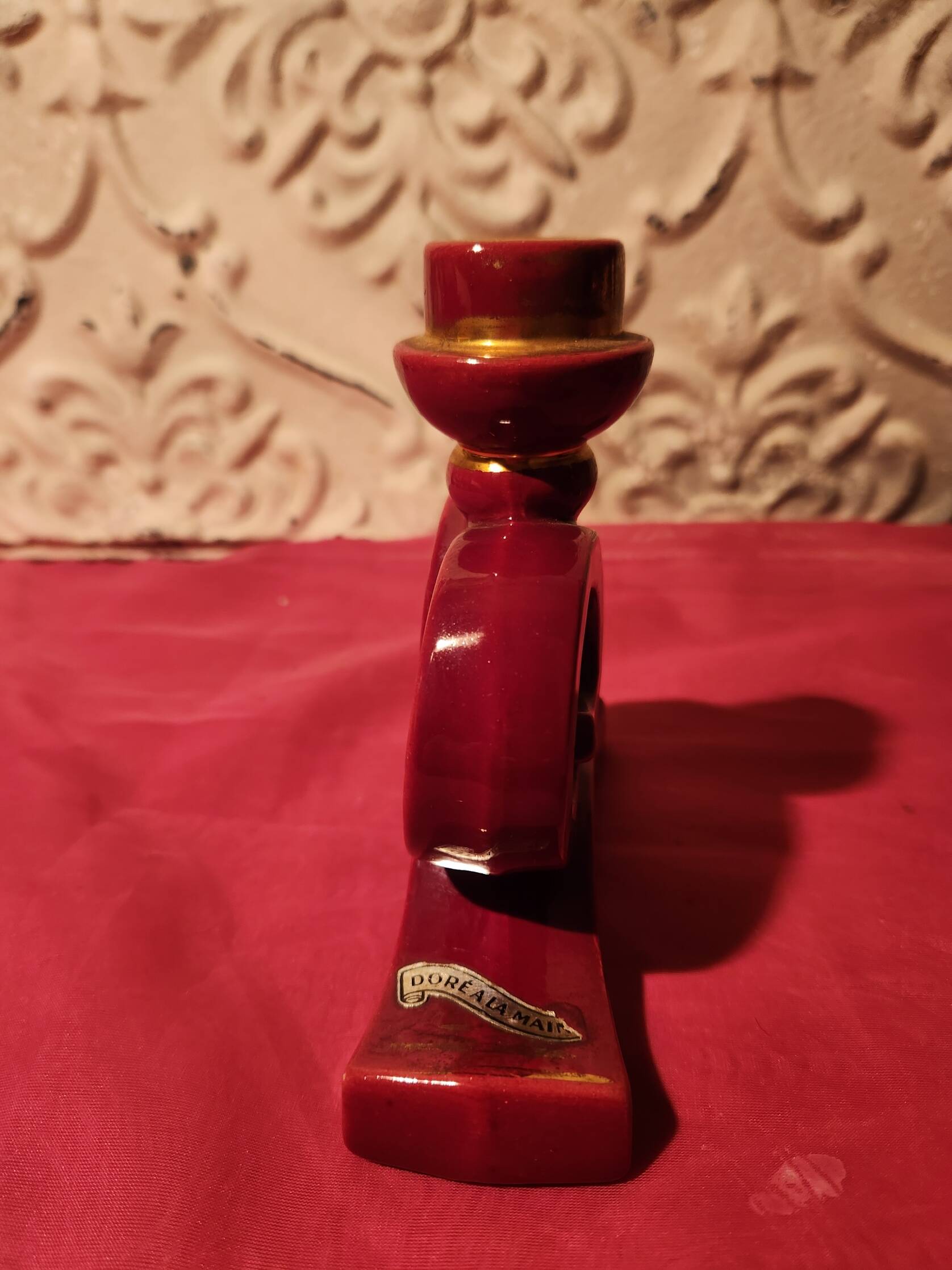 Pair of vintage ceramic candle holders, hand-painted in red and gold.