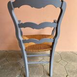 Provencal style straw armchair with gray blue patina armrests
