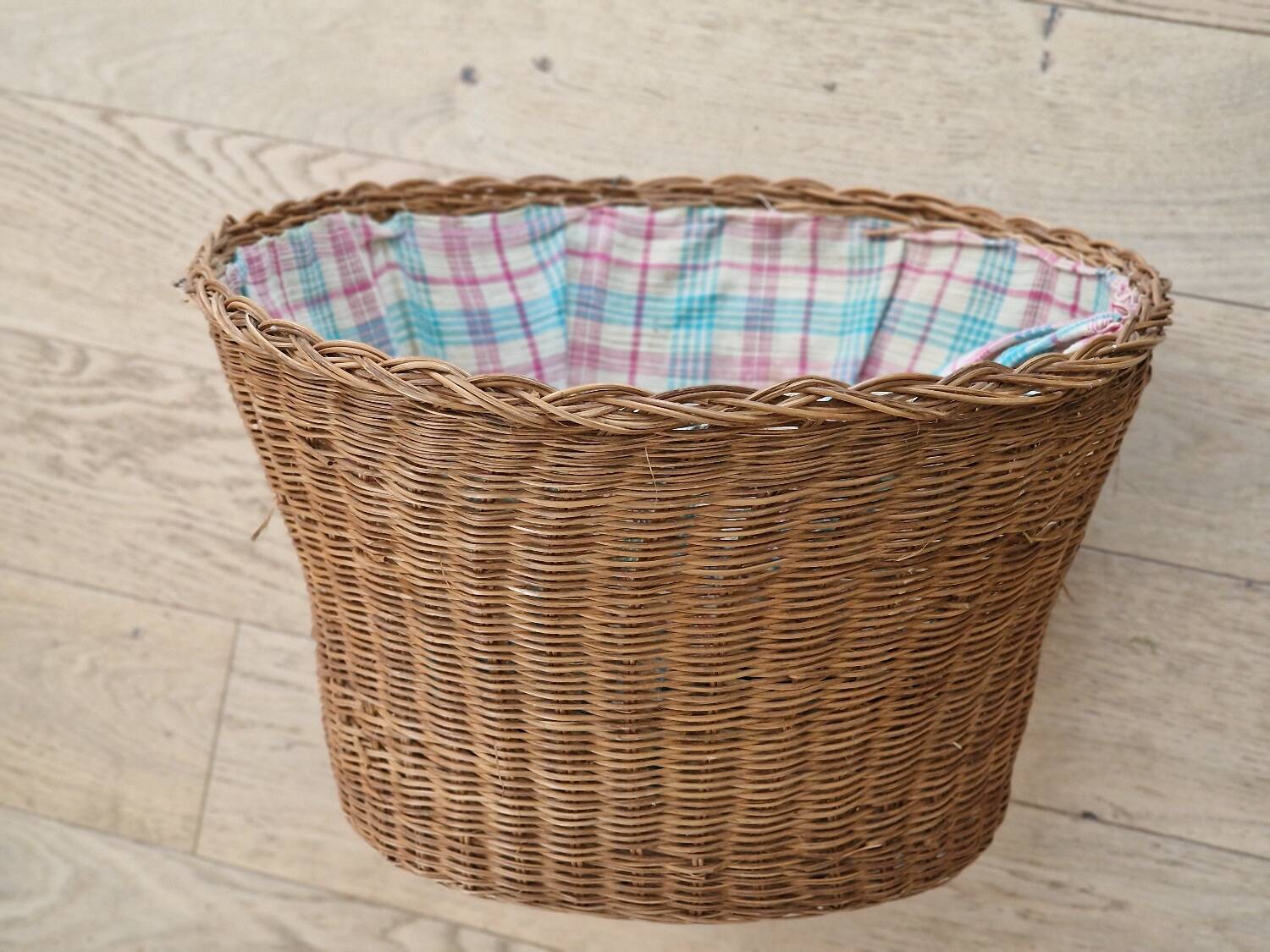 Vintage rattan basket lined with fabric