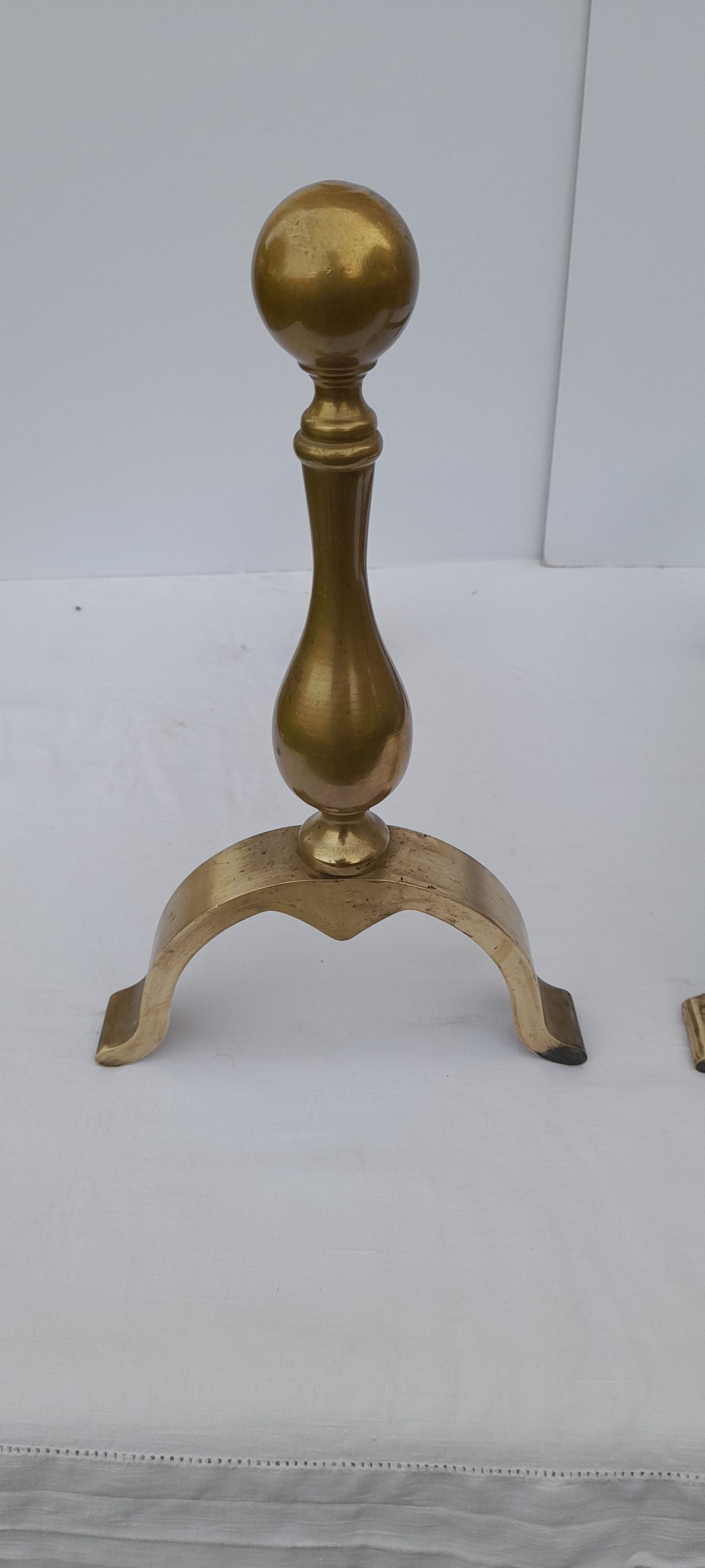 Pair of brass and black wrought iron chenets