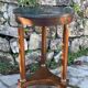 Empire style mahogany and mahogany veneer tripod pedestal table