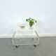 Space age plexiglas trolley met messing