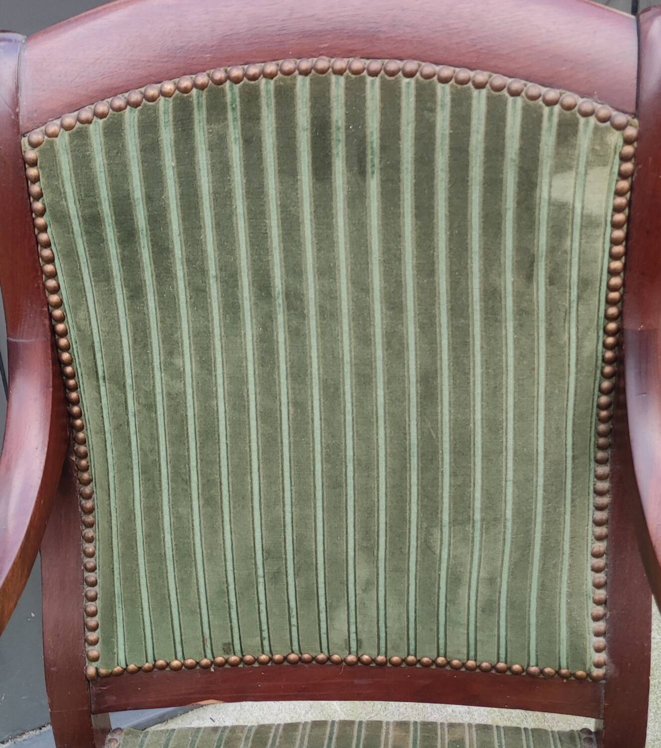 Old green velvet armchair