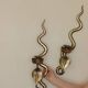 Pair of Egyptian Revival Style Engraved Brass Cobra Sconces