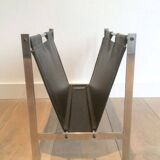 Magazine rack in brushed steel and leather, in the style of Poul Kjaerholm