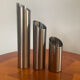 Vintage trio of brushed stainless steel candle holders