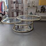 Gold brass coffee table with rotating trays.