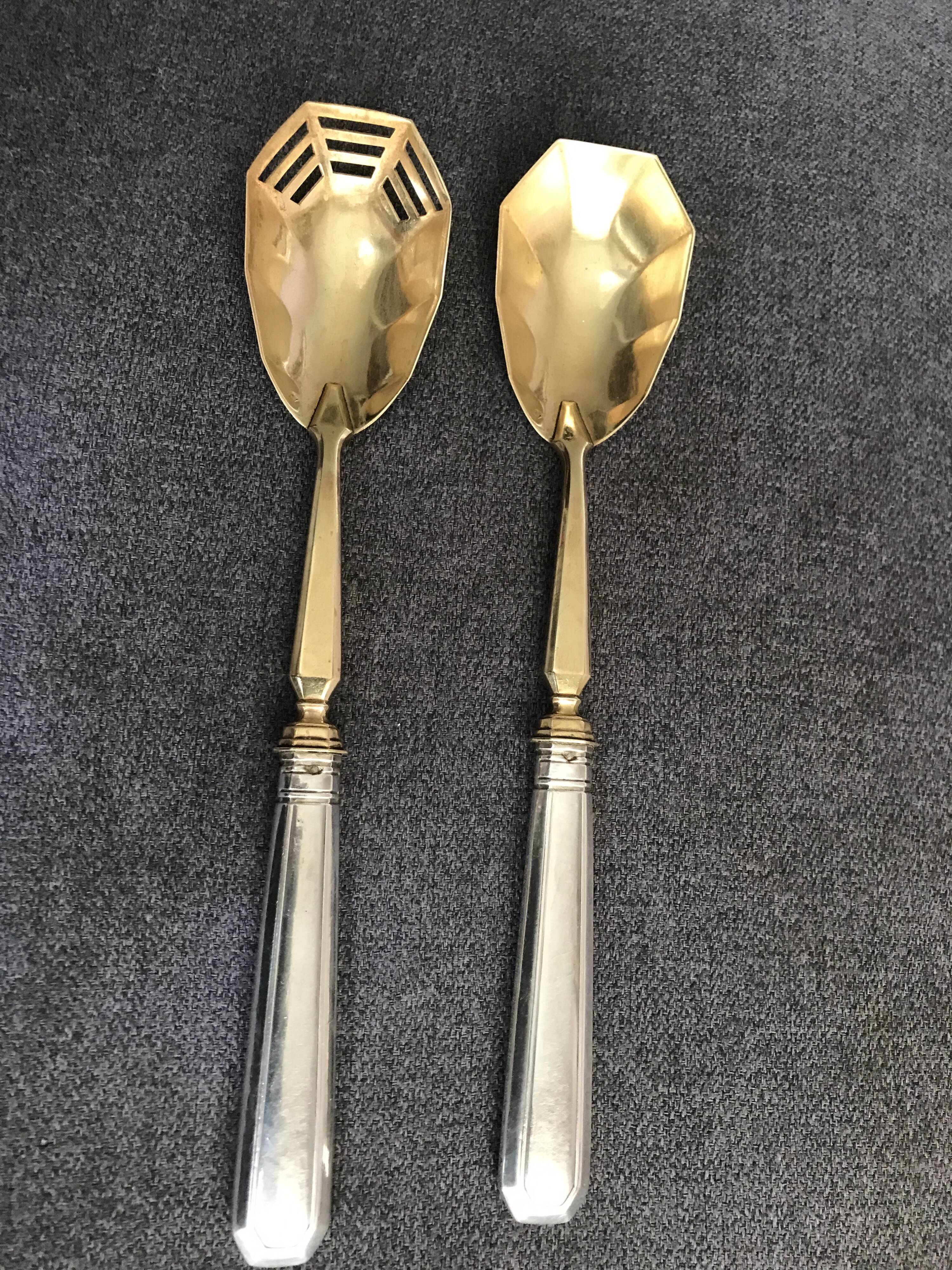 Pair of serving spoons in silver hallmark neck brace