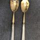 Pair of serving spoons in silver hallmark neck brace