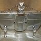 Art Deco fire screen from around 1920 in polished chrome with a bear.