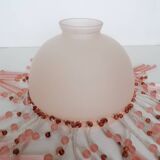 Pink glass wall lamp with garland of pearls