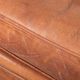 Comfortable vintage sheepskin armchair finished with decorative nails