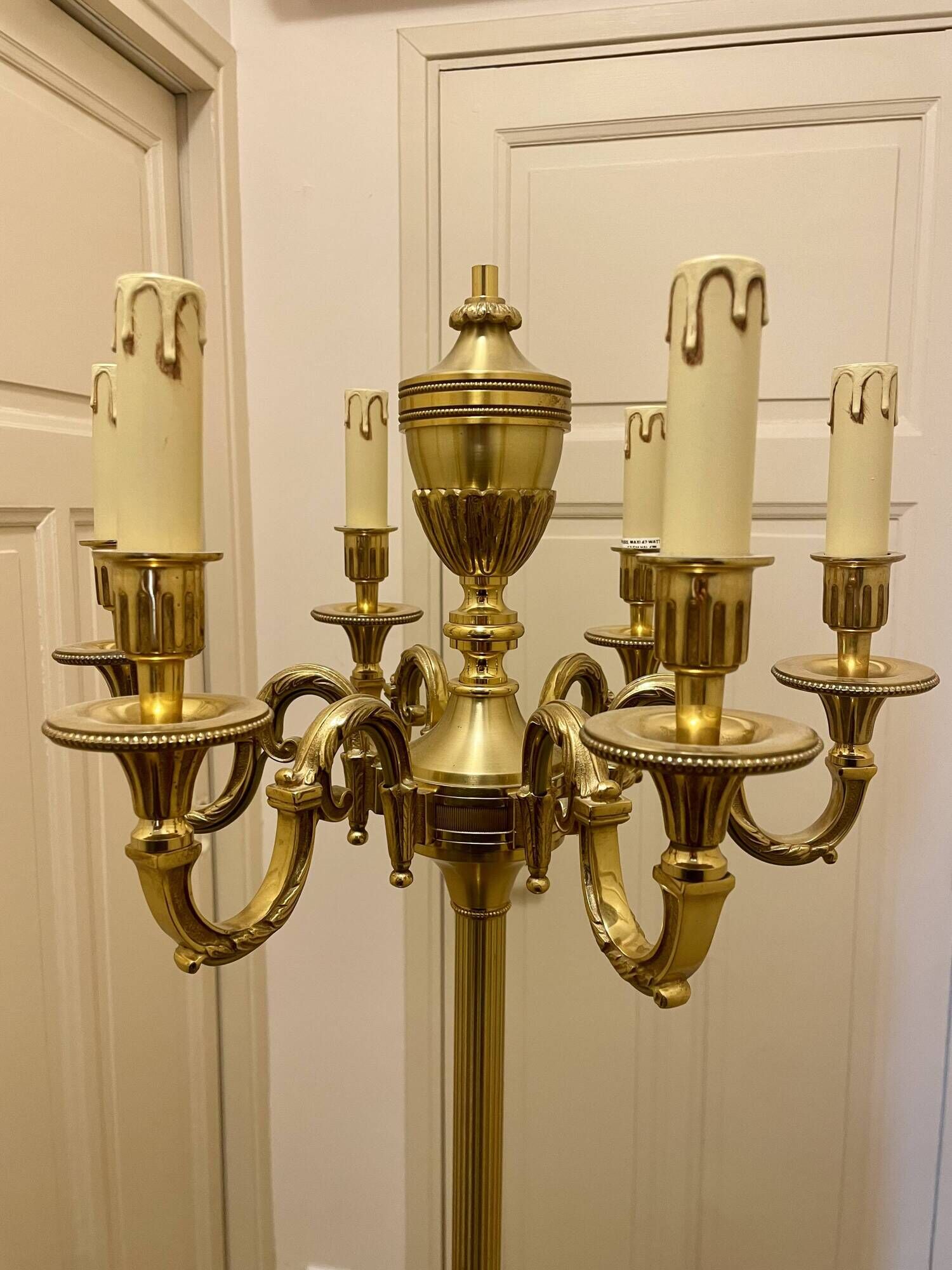 Bronze floor lamp by Lucien Gau, with a six-light shade model 16136.