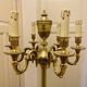 Bronze floor lamp by Lucien Gau, with a six-light shade model 16136.